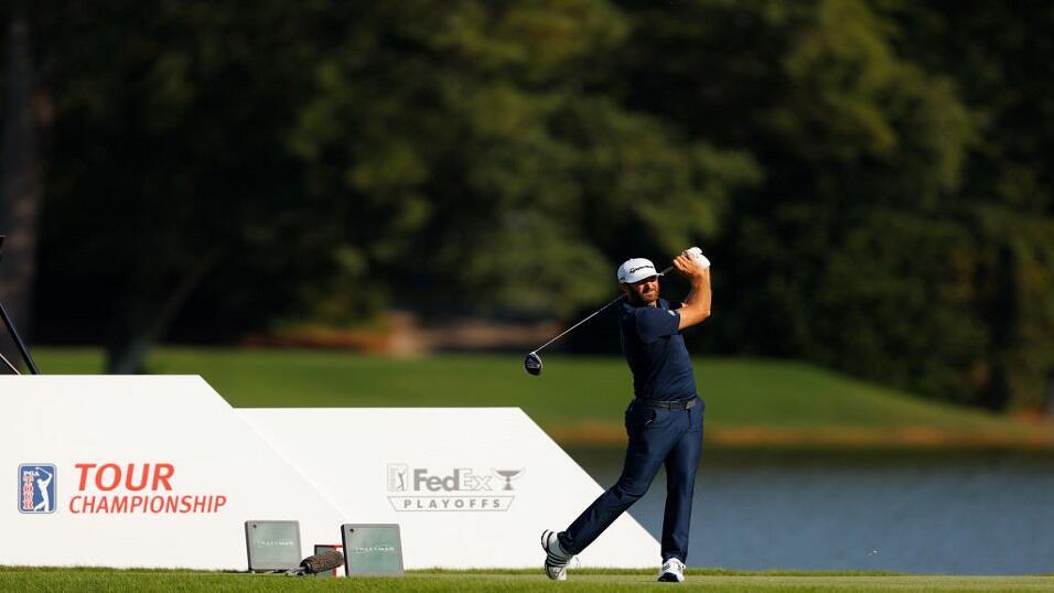 Dustin Johnson drives off the tee at the Tour Championship